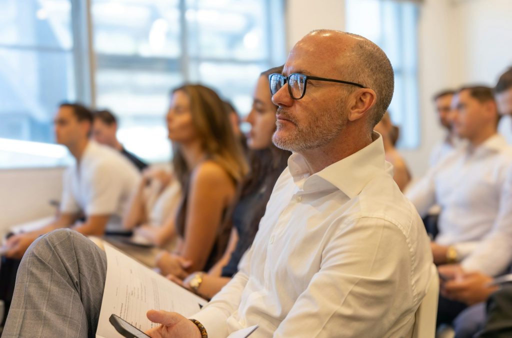 A group of people attend a business conference